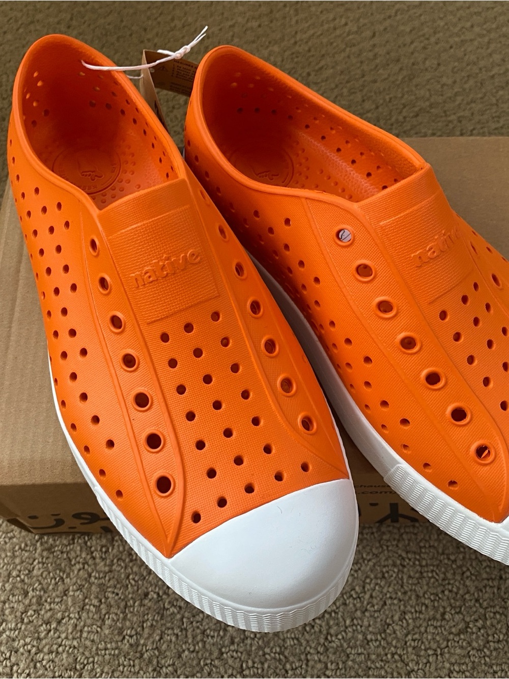 Native Kids Slip-On Shoes in Bright Orange with White Toe